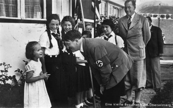Adolf Hitler greets a little girl during a BDM visit at Haus Wachenfeld